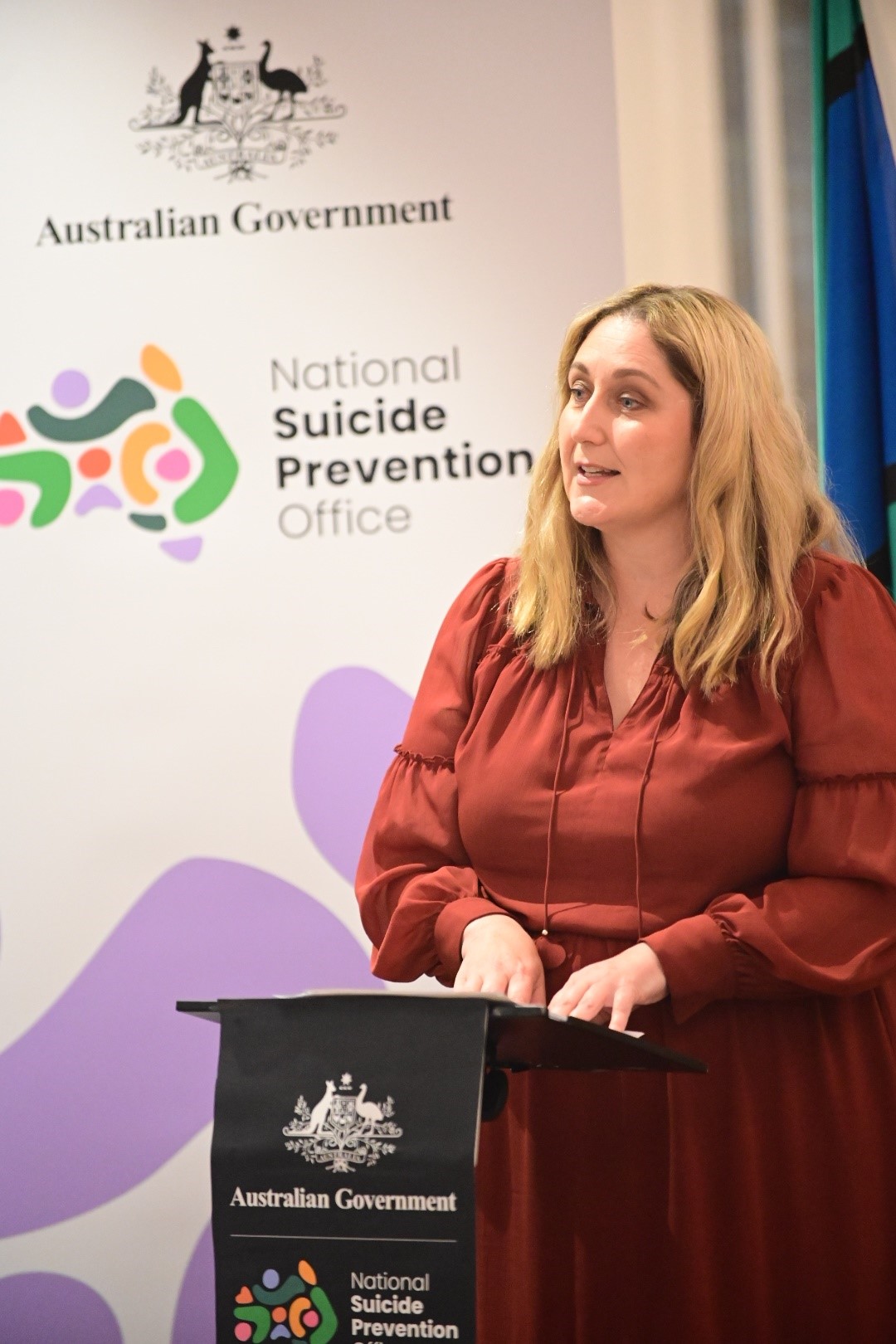 The Hon. Emma McBride speaking on stage