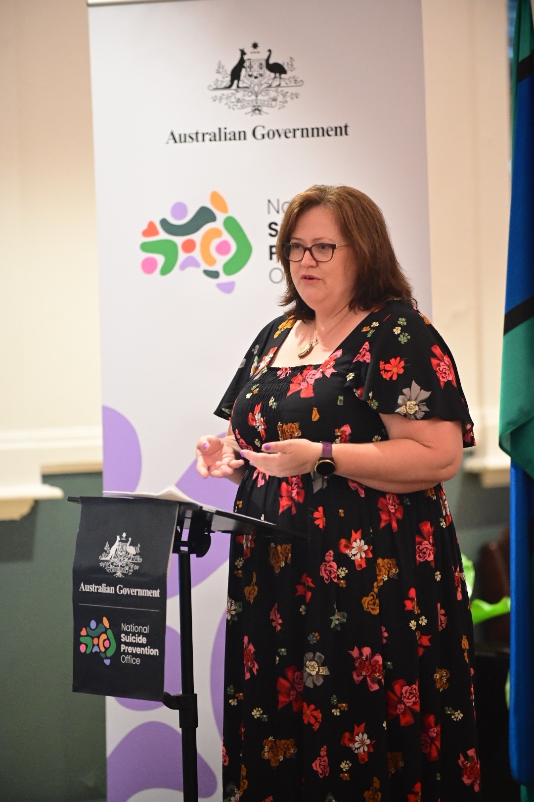 Jo Riley speaking on stage