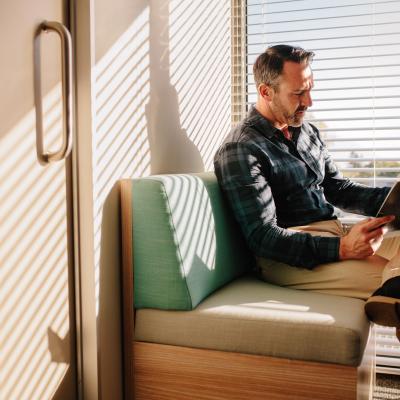 Image of man reading a magazine